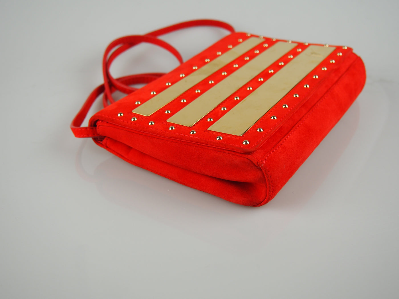 Red suede studded clutch