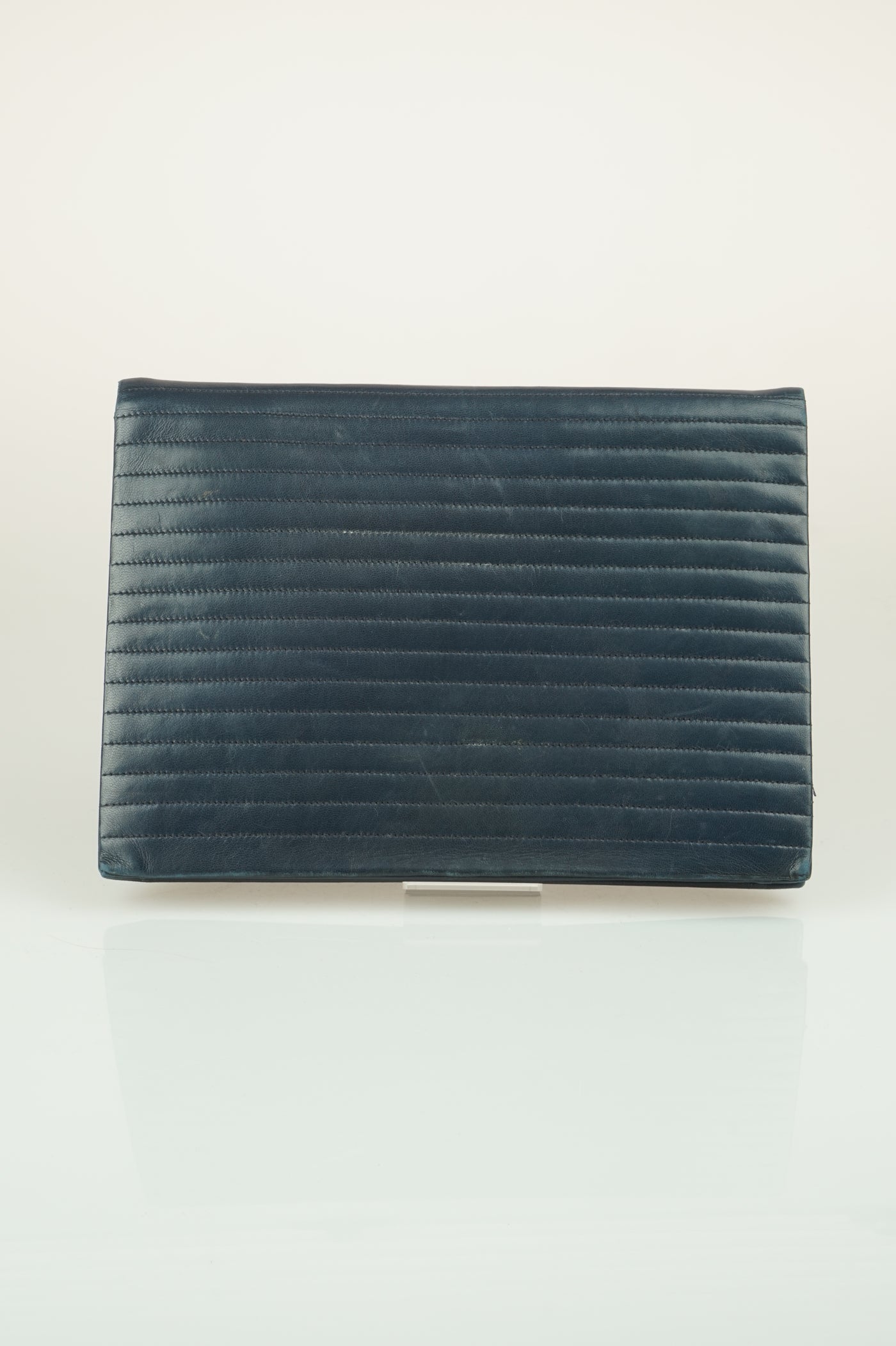 Navy quilted clutch