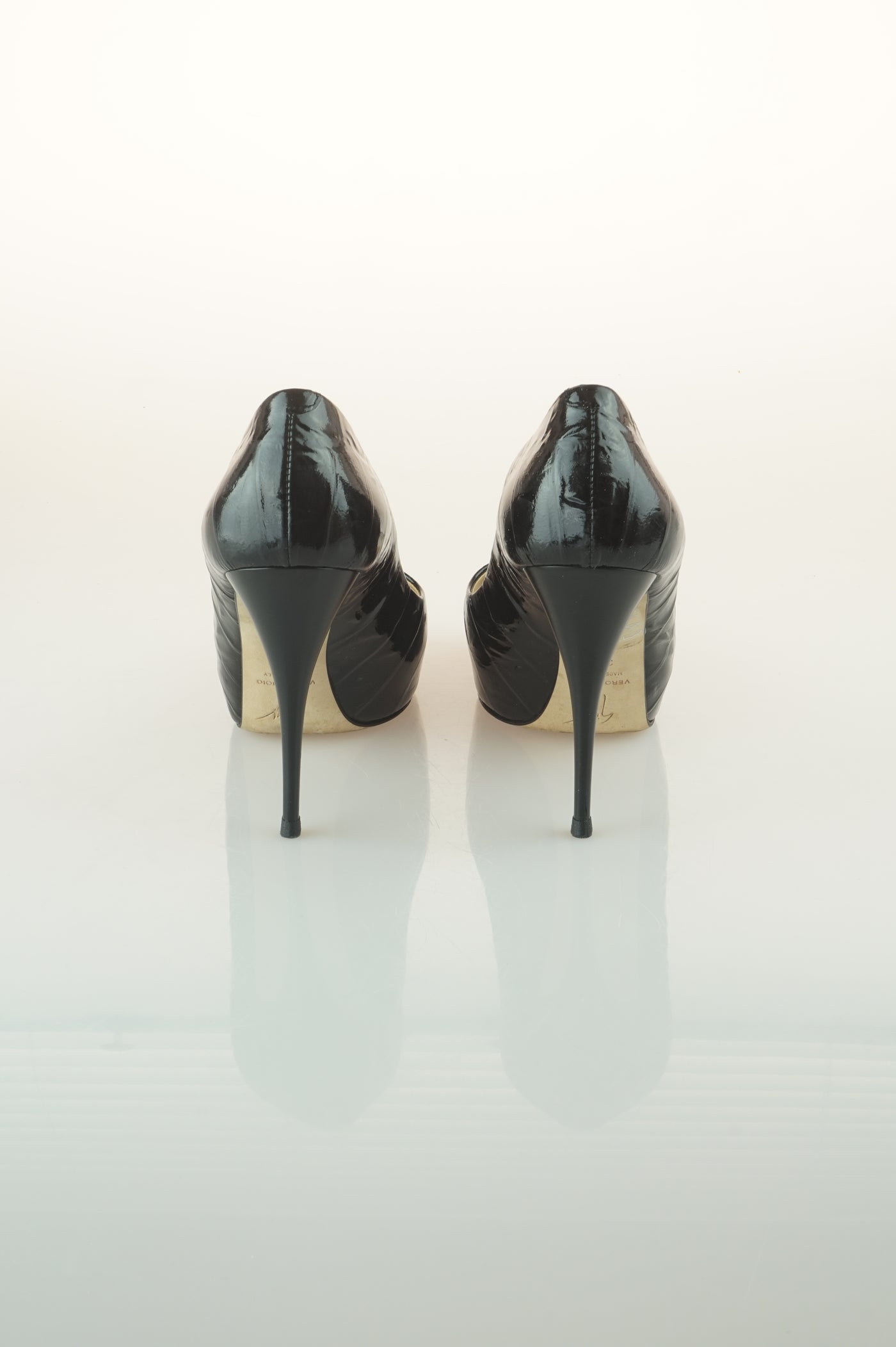 Black patent peep toes