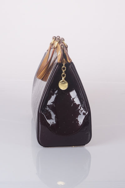 Brea amaranth vernis handbag