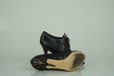 Black skeleton lace-ups